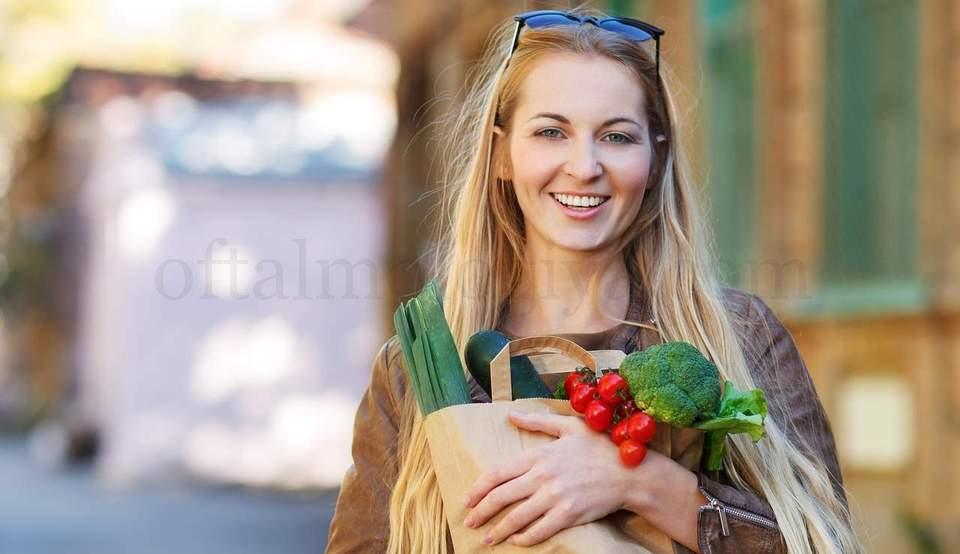 Young happy woman with shopping bags outdoors
